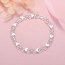 Bracelet argentée en forme de chaîne avec des coeurs